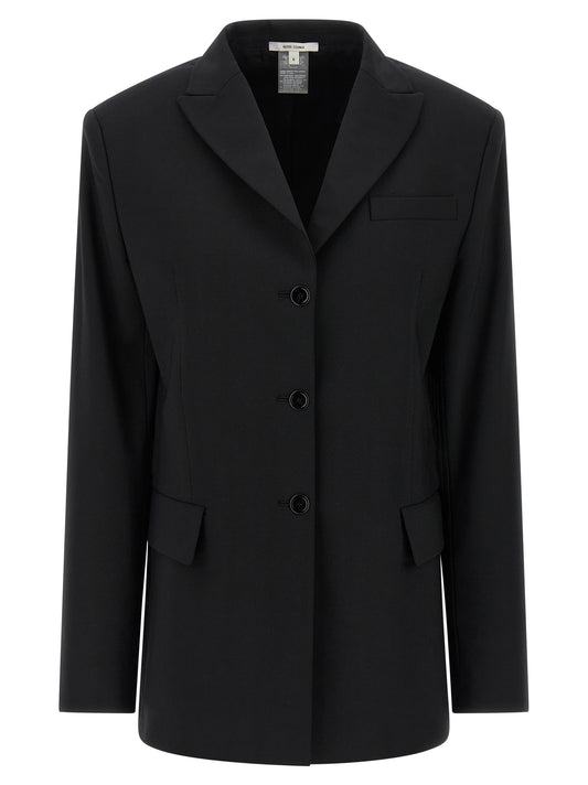 This Blazer by Nensi Dojaka for women in polyester & virgin wool black presents a tailored silhouette, meticulously tailored with a tailored split neckline and distinctive for a tailored finish.