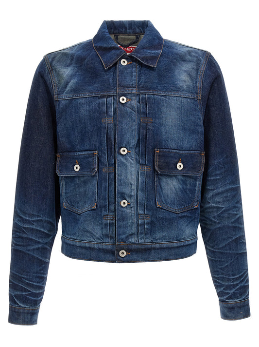 This Trucker Jacket by Kenzo for men in cotton denim blue exhibits a edgy silhouette, meticulously detailed with functional pockets and a edgy shirt-collar neckline for a edgy finish.
