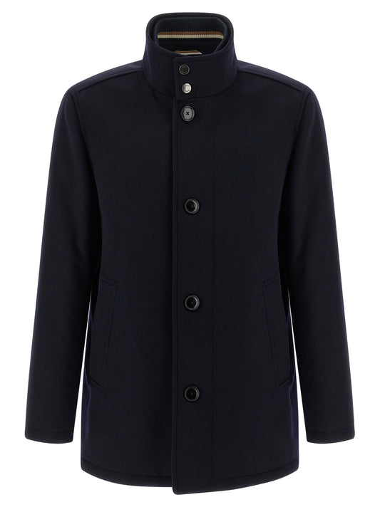 Vest by Hugo Boss for men in cashmere wool & nylon blue showcases a dynamic silhouette, perfectly balancing with a dynamic high-neck neckline for a sophisticated, high-fashion look.
