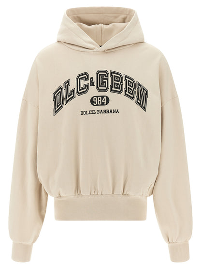 Sweatshirt Hoodie by Dolce & Gabbana for men in cotton beige & print showcases a city-ready silhouette, artfully detailed with a signature hooded neckline and long-sleeve for a city-ready finish.
