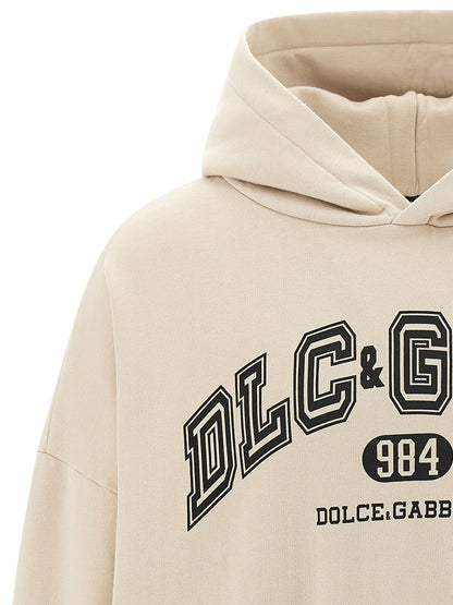 Sweatshirt Hoodie by Dolce & Gabbana for men in cotton beige & print features a authentic silhouette, showcasing a sophisticated hooded neckline and authentic detail for a refined finish.
