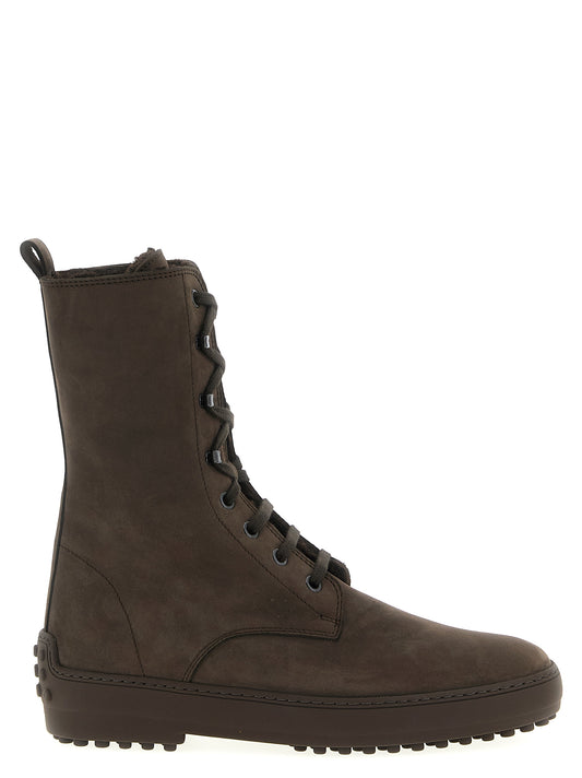 Ankle Winter Boots by Tod's for women in suede calfskin leather brown features an dynamic silhouette, showcasing the dynamic Gommini Women's Suede Calfskin Leather Ankle Winter Boots design with its distinctive and elegant .