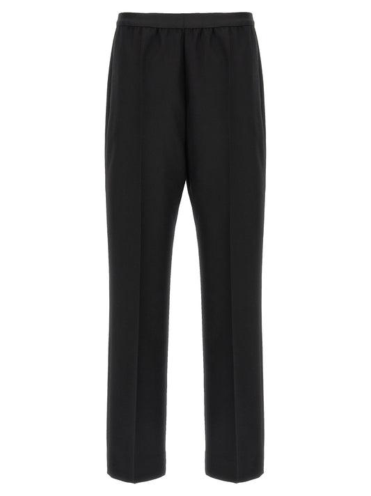 Trousers by Maison Margiela for women in virgin wool black features an sartorial silhouette, showcasing a precise straight-leg and long with a sartorial for a refined look.