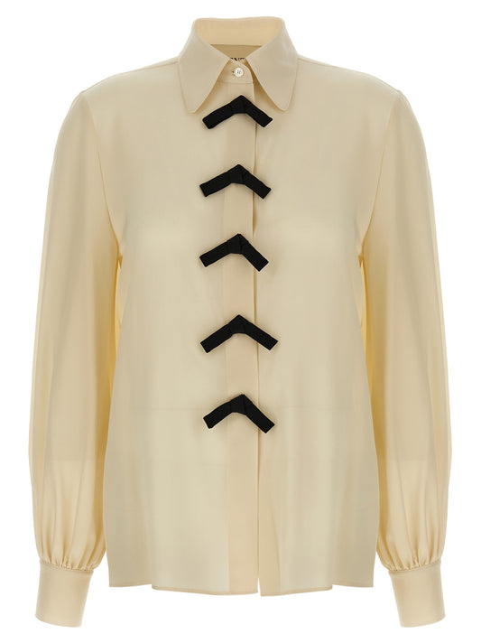 Blouse by Valentino Garavani for women in silk crepe beige presents a discerning silhouette, showcasing a sophisticated and for a truly discerning finish.