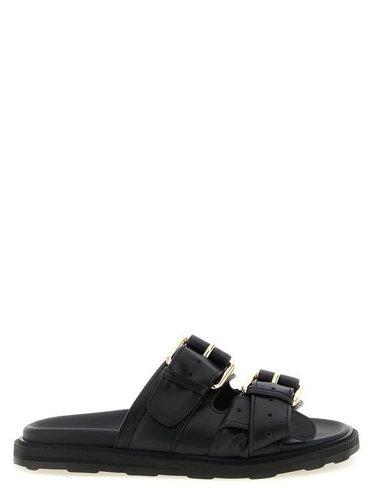 Sliders Sandals Flat Shoes by Moschino for women in calfskin leather black presents a effortless chic silhouette, showcasing the City Women's Calfskin Leather Sliders Sandals Flat Shoes design with a effortless chic and for a sophisticated look.