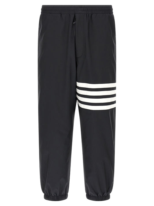Joggers by Thom Browne for men in polyamide & polyester blue & print features an sophisticated and straight-leg with a precise long, creating a sophisticated and sophisticated silhouette.