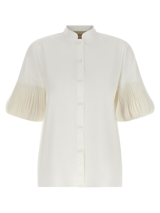 Blouse by Valentino Garavani for women in cotton white & patterned showcases a sharp silhouette, elegantly detailed with a sharp mandarin neckline and sharp short-sleeve.