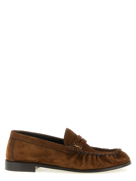 Loafer Slip-On Shoes by Saint Laurent for men in suede calfskin leather brown showcases a impeccable silhouette as Cassandre Men's Suede Calfskin Leather Loafer Slip-On Shoes, artfully designed with a impeccable and refined moc toe style for a impeccable finish.