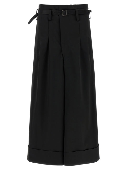 Trousers by Junya Watanabe for women in satin acetate wool black features a tailored silhouette with a tailored flared, wide & cropped, defined by its cropped and a sophisticated high rise.