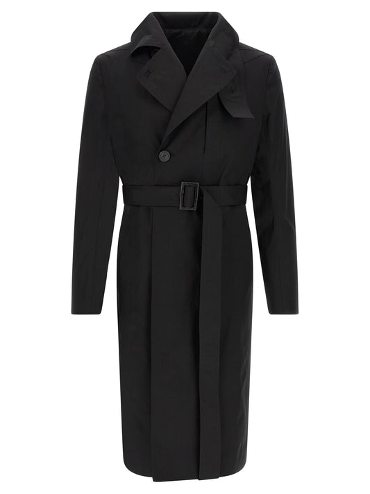 Trench Coat by Rick Owens for men in stretch cotton black presents a utilitarian silhouette, showcasing a utilitarian and sophisticated insulated for a truly utilitarian look.