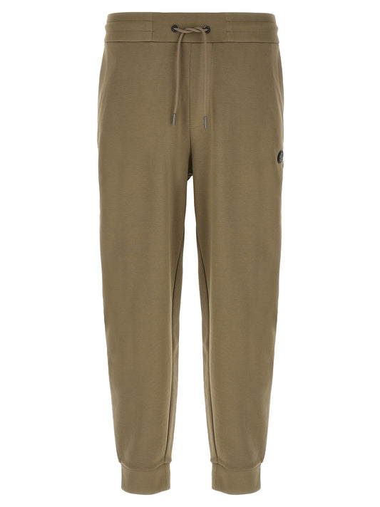 Joggers by Hugo Boss for men in polyester cotton & leather bicolour & green presents a tailored silhouette, showcasing a tailored straight-leg and long cut with a refined for a truly tailored aesthetic.