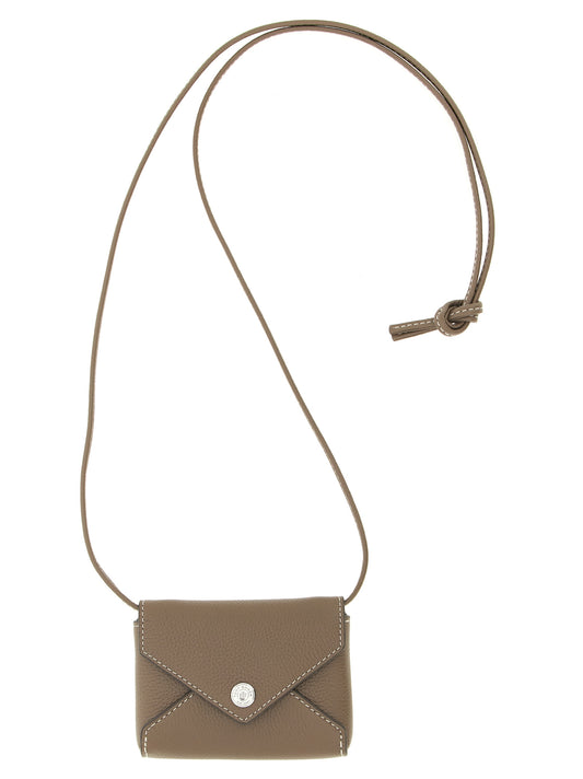 Cardholder Card Case by Tory Burch for women in bos taurus calf suede leather brown features a distinguished silhouette, showcasing the distinguished design of the Bos Taurus Calf Suede Leather Cardholder Card Case with refined card-organization.