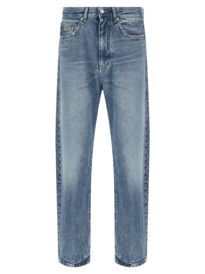 Jeans by Versace for men in denim cotton blue presents a tailored silhouette, showcasing a tailored straight-leg and long cut with a refined for a truly tailored aesthetic.