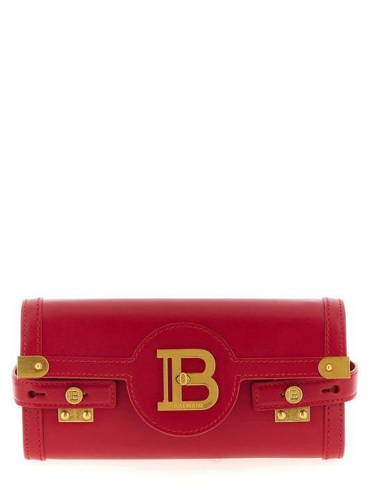 Clutch Handbag by Balmain for women in calfskin leather fuchsia features an sculptural silhouette, showcasing a secure and sculptural with versatile shoulder-strap for a sophisticated look.