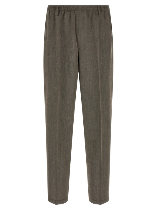 Trousers by CELLAR DOOR for men in virgin wool brown presents a perennial silhouette, meticulously tailored with a tapered-leg & wide cut, long finish, and an elegant .