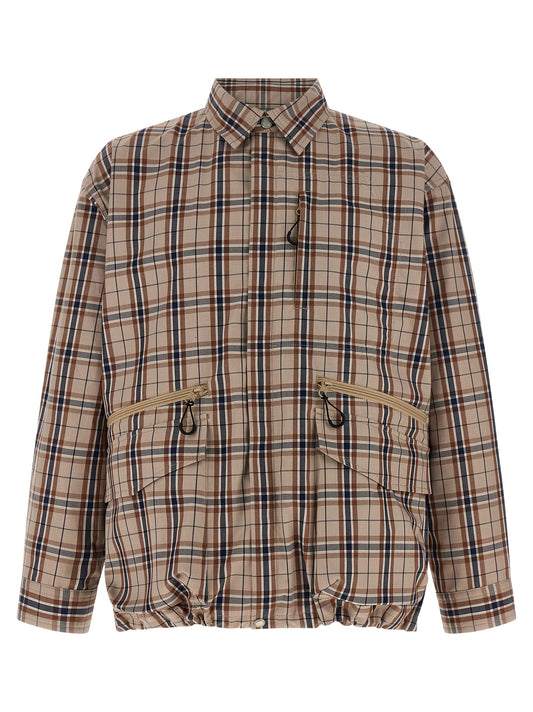 Overcoat by Comme Des Garçons for men in nylon cotton polyester beige & print showcases a architectural silhouette, artfully detailed with a distinctive shirt-collar neckline and functional pockets for a architectural finish.