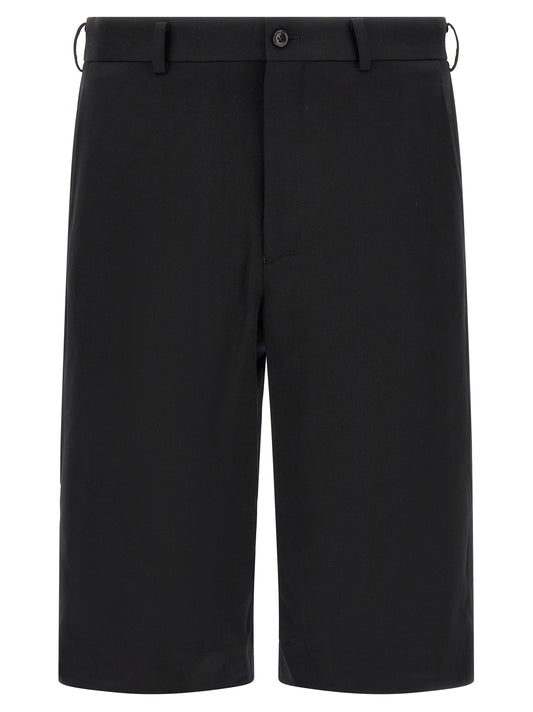 Bermuda Shorts by Comme Des Garçons for men in wool black presents a contemporary silhouette, showcasing a contemporary straight-leg, flared & wide with a refined short and elegant .