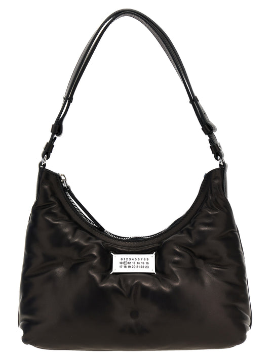 Small Quilted Shoulder Hobo Bag by Maison Margiela for women in polyester black presents a statuesque silhouette, showcasing a secure zipper and statuesque with versatile shoulder-strap, adjustable-strap & handle for a sophisticated look.