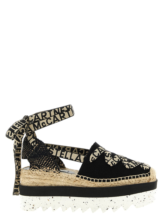 Wedge Sandals by Stella McCartney for women in cotton canvas & raffia multicolor features an architectural design from the Women's Cotton Canvas & Raffia Wedge Sandals collection, defined by a architectural wedge and for a architectural finish.
