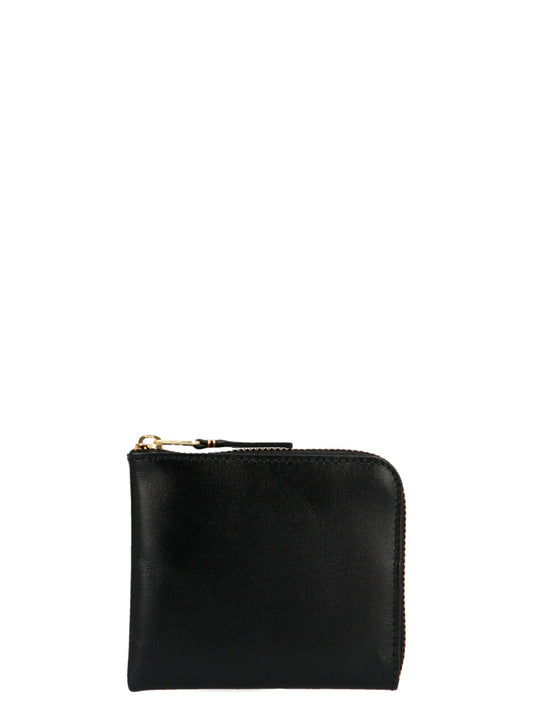 Wallet by Comme Des Garçons for men in calfskin leather black showcases a enchanting silhouette, artfully detailed with the signature style of the Arecalf Calfskin Leather Wallet and functional zip-around.