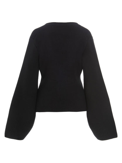 Cardigan by Khaite for women in cashmere black presents a textural silhouette, artfully finished with a textural v-neck neckline and for a sophisticated, textural look.