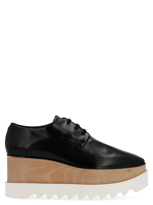 Wedge Lace-Up Sandals by Stella McCartney for women in polyester polyethylene polyurethane leather black & signature showcases a sculptural silhouette as Women's Polyester Polyethylene Polyurethane Leather Wedge Lace-Up Sandals, defined by a sculptural wedge and sculptural for a sculptural look.