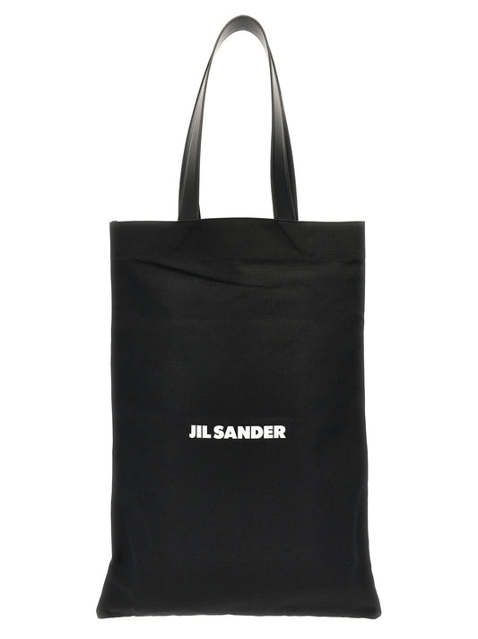 Large Shopper Tote Bag by Jil Sander for women in linen poly cotton canvas & leather black & print showcases a urban-chic Linen Poly Cotton Canvas & Leather Large Shopper Tote Bag design, featuring a secure , ample , and versatile handle for a urban-chic finish.