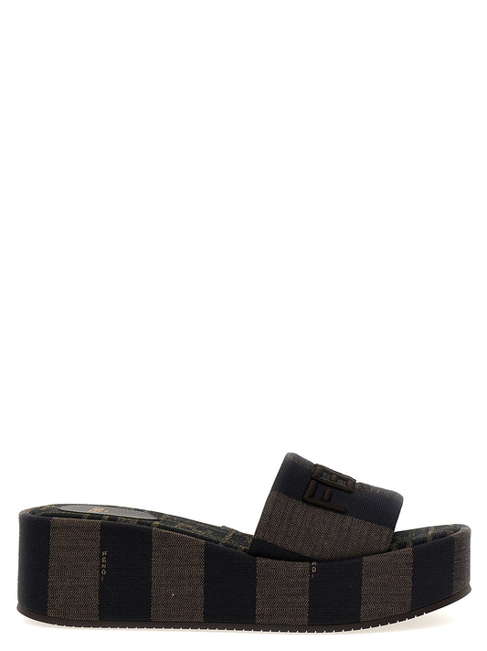 Sliders Sandals Flat Shoes by Fendi for women in cotton brown & striped features an captivating silhouette, showcasing the captivating style of the Women's Cotton Sliders Sandals Flat Shoes with its distinct and refined .