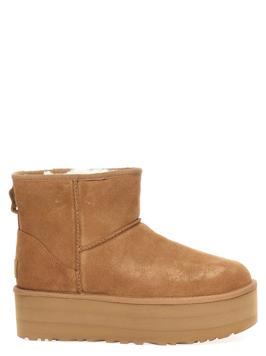 Platform Ankle Boots by UGG for women in eva & cowhide suede leather brown features an high-performance silhouette, showcasing the sophisticated design of the The Blend Women's EVA & Cowhide Suede Leather Platform Ankle Boots with a platform and a refined .