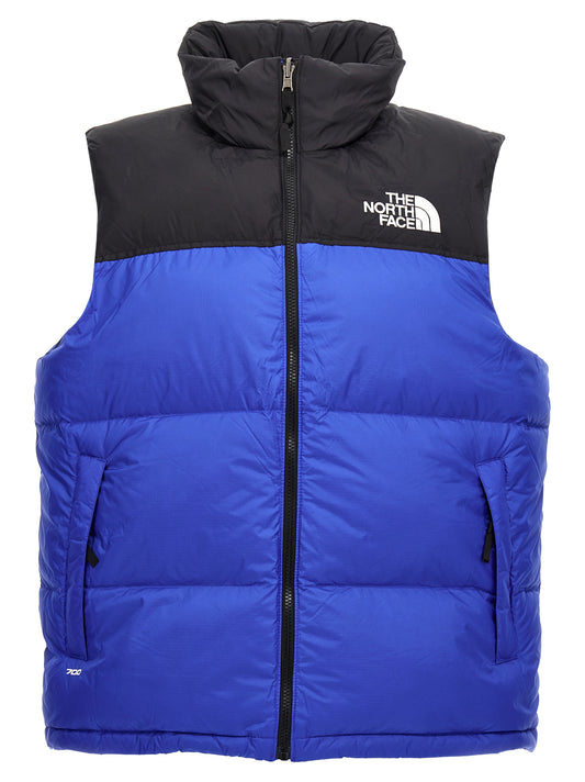 Hooded Vest by The North Face for men in plush nylon blue & signature features a enviable silhouette, elegantly detailed with a enviable hooded neckline and functional pockets & hooded for a enviable finish.