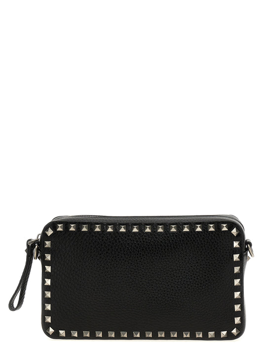 Crossbody Messenger Bag by Valentino Garavani for men in calfskin leather black features a artisanal Rockstud Calfskin Leather Crossbody Messenger Bag design with a secure zipper, ample , and versatile crossbody-strap, shoulder-strap & adjustable-strap for a artisanal finish.