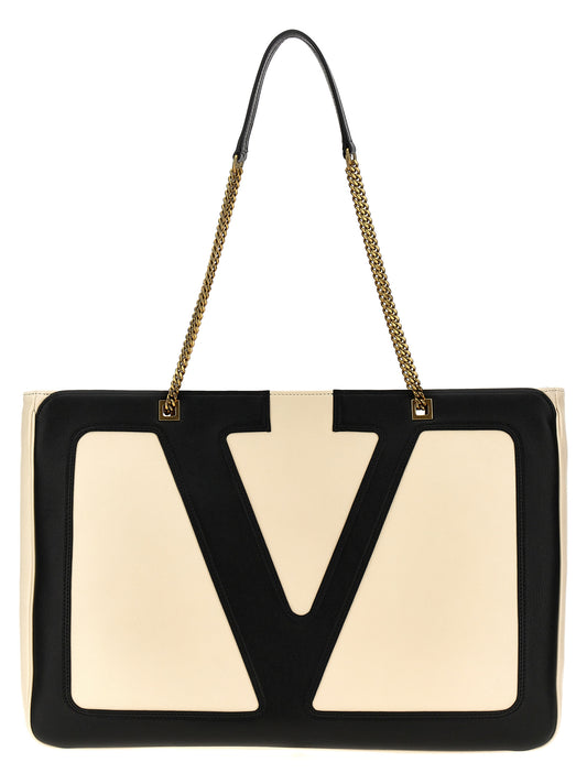 Large Shopper Tote Bag by Valentino Garavani for women in lamb leather bicolour, black, white & signature features a jet-set Viva Superstar V Logo Lamb Leather Large Shopper Tote Bag design, complete with a secure zipper, ample , and versatile handle for a jet-set look.
