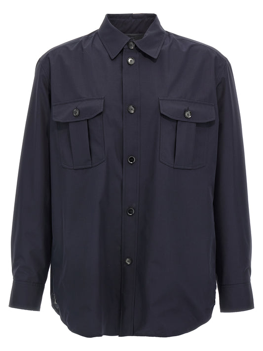 Jacket by Brioni for men in silk blue showcases a contemporary silhouette, detailed with a contemporary wrap shirt-collar neckline and premium pockets for a sophisticated finish.