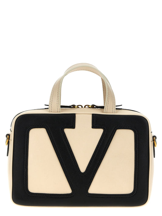 Crossbody Tote Handbag by Valentino Garavani for women in polyester & lamb leather bicolour, black, white & signature presents a ornamental silhouette, showcasing a secure zipper, ample , and versatile crossbody-strap, shoulder-strap, adjustable-strap, detachable-strap & handle for a ornamental finish.