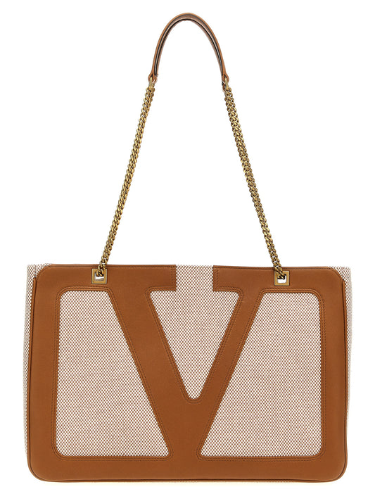 Medium Shopper Tote Bag by Valentino Garavani for women in stretch cotton modal canvas beige & signature features a jet-set sophisticated Viva Superstar V Logo Stretch Cotton Modal Canvas Medium Shopper Tote Bag design with a secure zipper, ample , and versatile handle for a jet-set sophisticated finish.