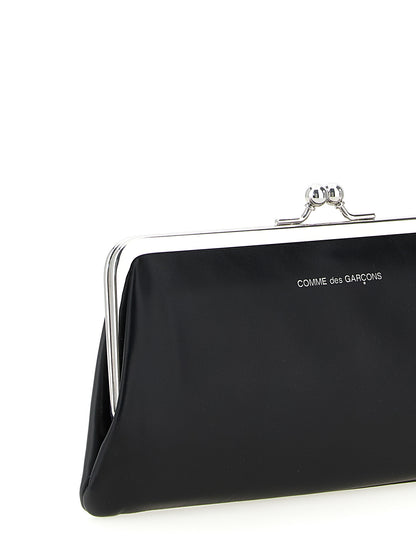 Wallet by Comme Des Garçons for men in leather black features a sleek silhouette, showcasing the sleek Leather Wallet design with sophisticated compact-design coin-purse for a premium look.