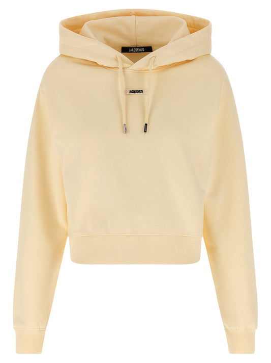 Sweatshirt Hoodie by Jacquemus for women in cotton beige features a slouchy chic silhouette, detailed with a slouchy chic and a signature hooded neckline for an elevated aesthetic.