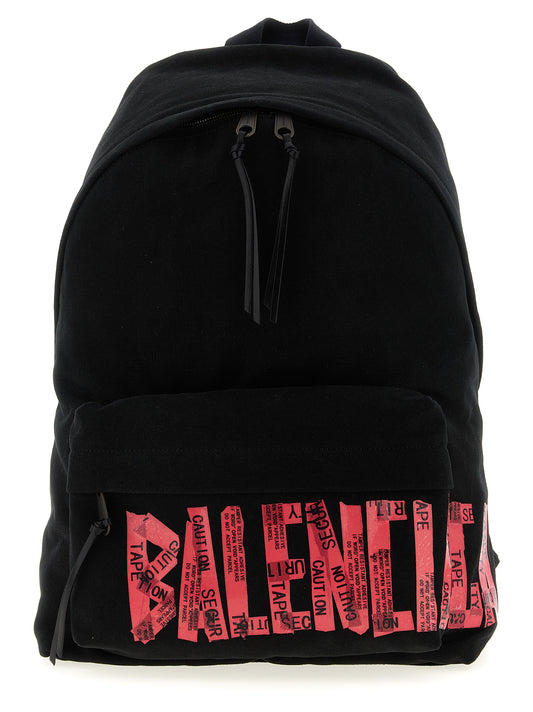 Backpack by Balenciaga for men in cotton polyester canvas black & print features a refined silhouette, showcasing the Tape Type Cotton Polyester Canvas Backpack design with a secure zipper, ample , and versatile backpack-strap & adjustable-strap.