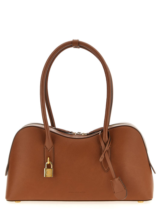 Shoulder Bag by Stella McCartney for women in polyurethane leather brown features a effortless sophistication silhouette, secured by a zipper with ample and versatile shoulder-strap & handle for a effortless sophistication finish.