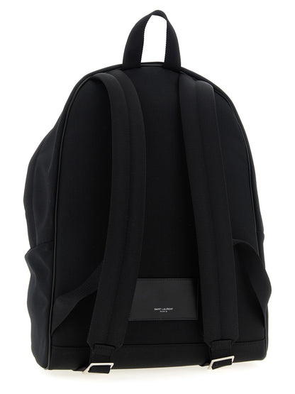Backpack by Saint Laurent for men in polyamide patent leather black features an ultra-portable silhouette from the Polyamide Patent Leather Backpack range, with a secure zipper, ample , and versatile handle, backpack-strap & adjustable-strap.