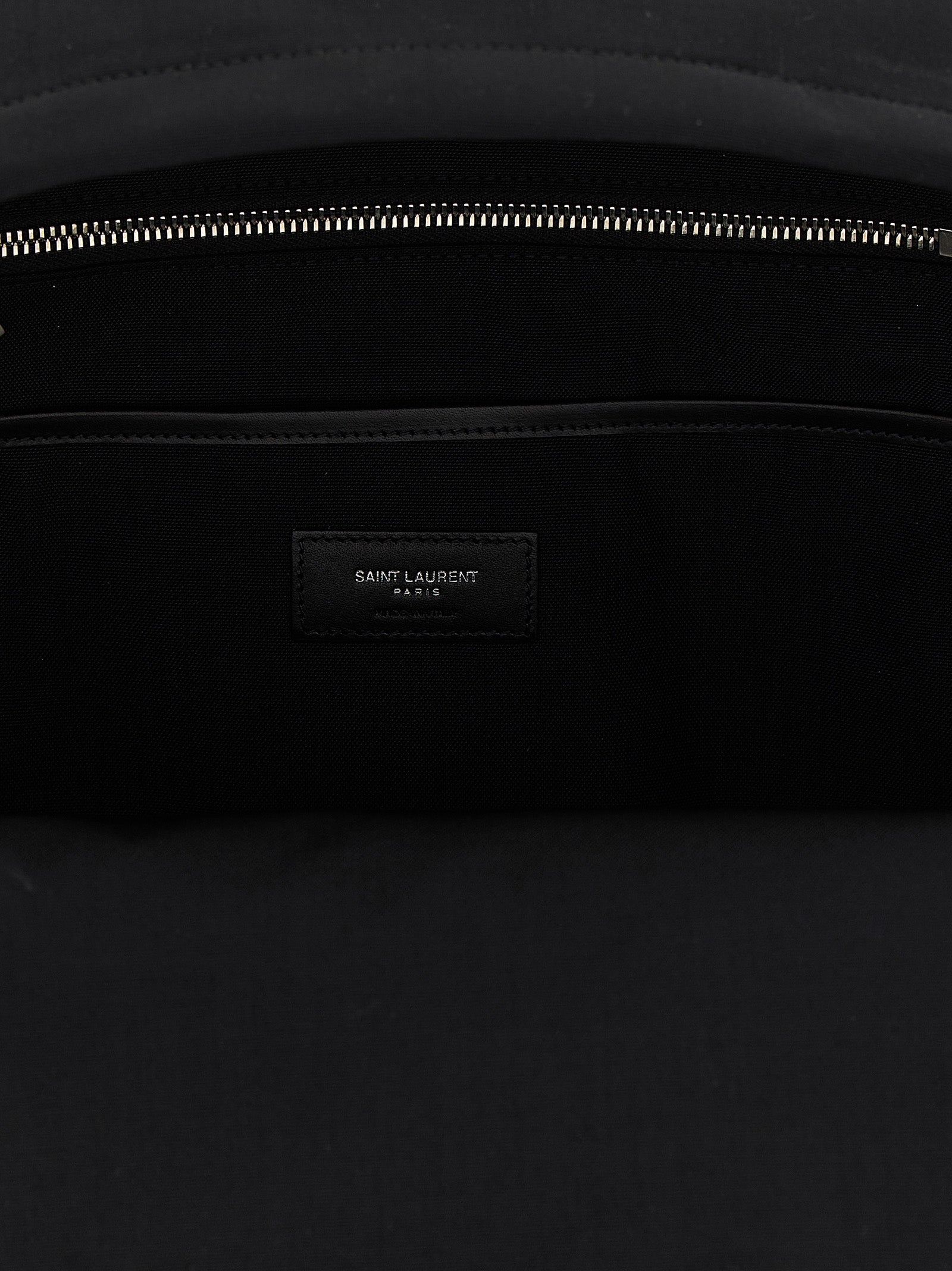 Backpack by Saint Laurent for men in polyamide patent leather black features a utilitarian chic Polyamide Patent Leather Backpack design with a secure zipper, ample , and versatile handle, backpack-strap & adjustable-strap for a utilitarian chic finish.
