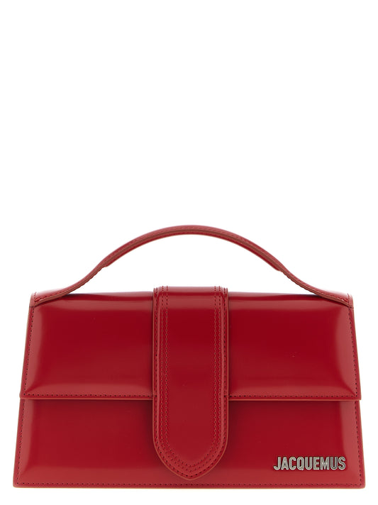 This Flap Handbag by Jacquemus for women in calfskin leather and multicolor & red presents a sculptural silhouette featuring a secure flap & magnetic, ample , and versatile shoulder-strap, handle & adjustable-strap for a sculptural finish.