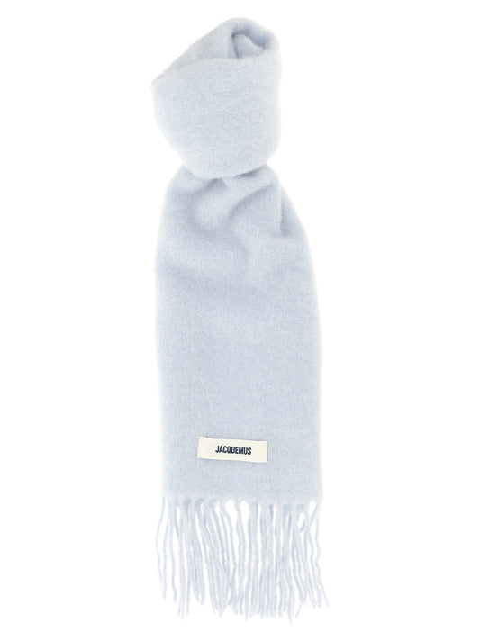 Scarf by Jacquemus for men in mohair alpaca polyamide & virgin wool light-blue features a timeless silhouette, artfully capturing the essence of the timeless Mohair Alpaca Polyamide & Virgin Wool Wrap Fringes Scarf design for a sophisticated look.