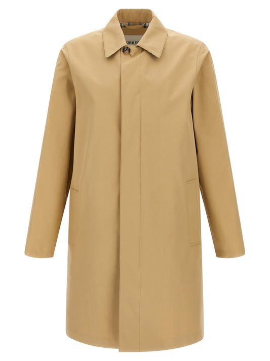 Trench Coat by Burberry for men in cotton beige presents a utilitarian silhouette, showcasing a utilitarian and sophisticated for a truly utilitarian look.