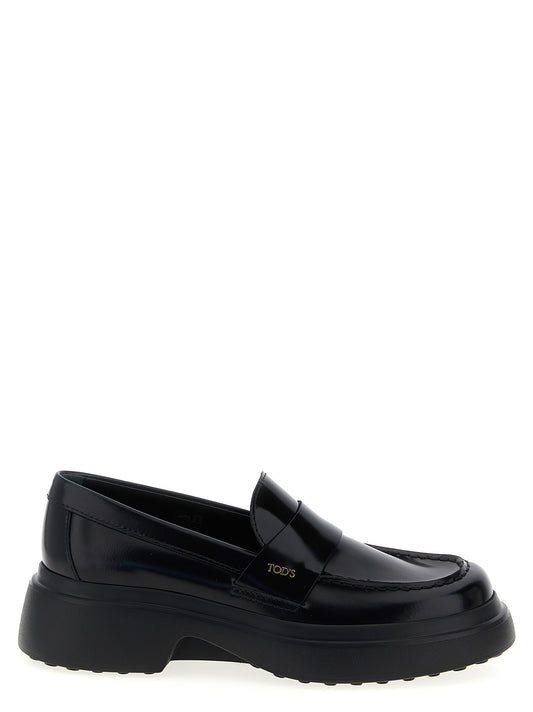 Flat Loafer Slip-On Shoes by Tod's for women in calfskin leather black showcases a resplendent Women's Calfskin Leather Flat Loafer Slip-On Shoes aesthetic, defined by its resplendent and elegant flat.