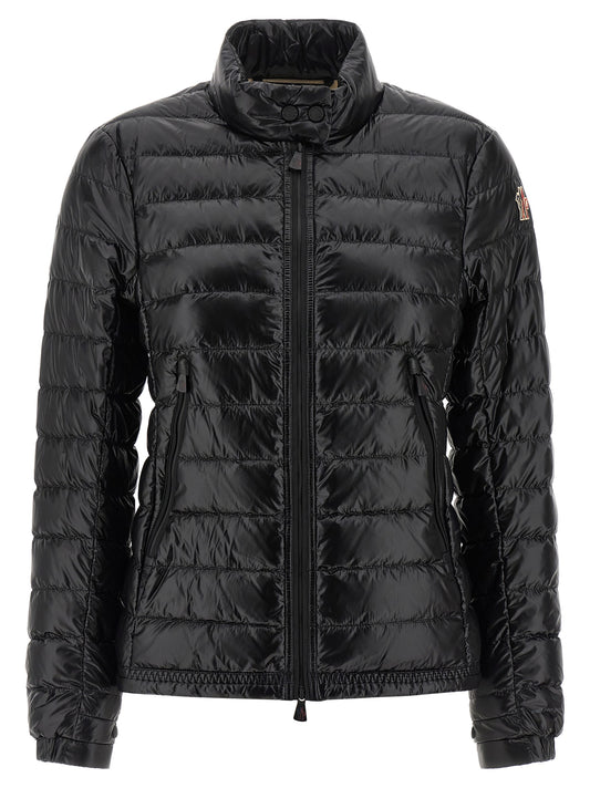 Puffer Jacket by Moncler Grenoble for women in nylon & goose-down black & signature features a dramatic silhouette, showcasing a sophisticated high-neck neckline and distinctive insulated for a dramatic aesthetic.