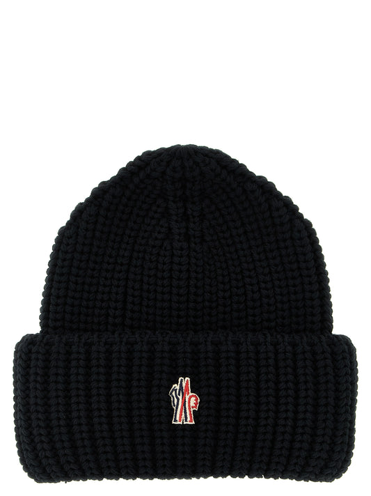 Beanie Hat by Moncler Grenoble for men in virgin wool black presents a sleek silhouette, showcasing the sleek texture and refined craftsmanship of the Virgin Wool Beanie Hat collection.