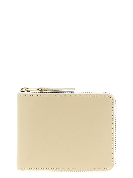 Cardholder Card Case by Comme Des Garçons for unisex in calfskin leather beige features a sleek silhouette, showcasing the sleek design of the Arecalf Calfskin Leather Cardholder Card Case with functional card-organization zip-around for a premium look.