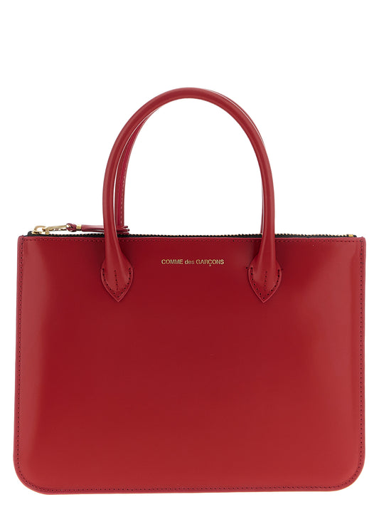 Handbag by Comme Des Garçons for unisex in bos taurus calf suede leather multicolor & red features a exquisite silhouette, showcasing a secure zipper and exquisite with versatile handle for a exquisite finish.