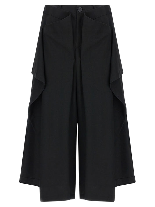 Trousers by Issey Miyake for women in wool black & signature features an sartorial silhouette, showcasing a precise wide and long with a sartorial for a refined look.